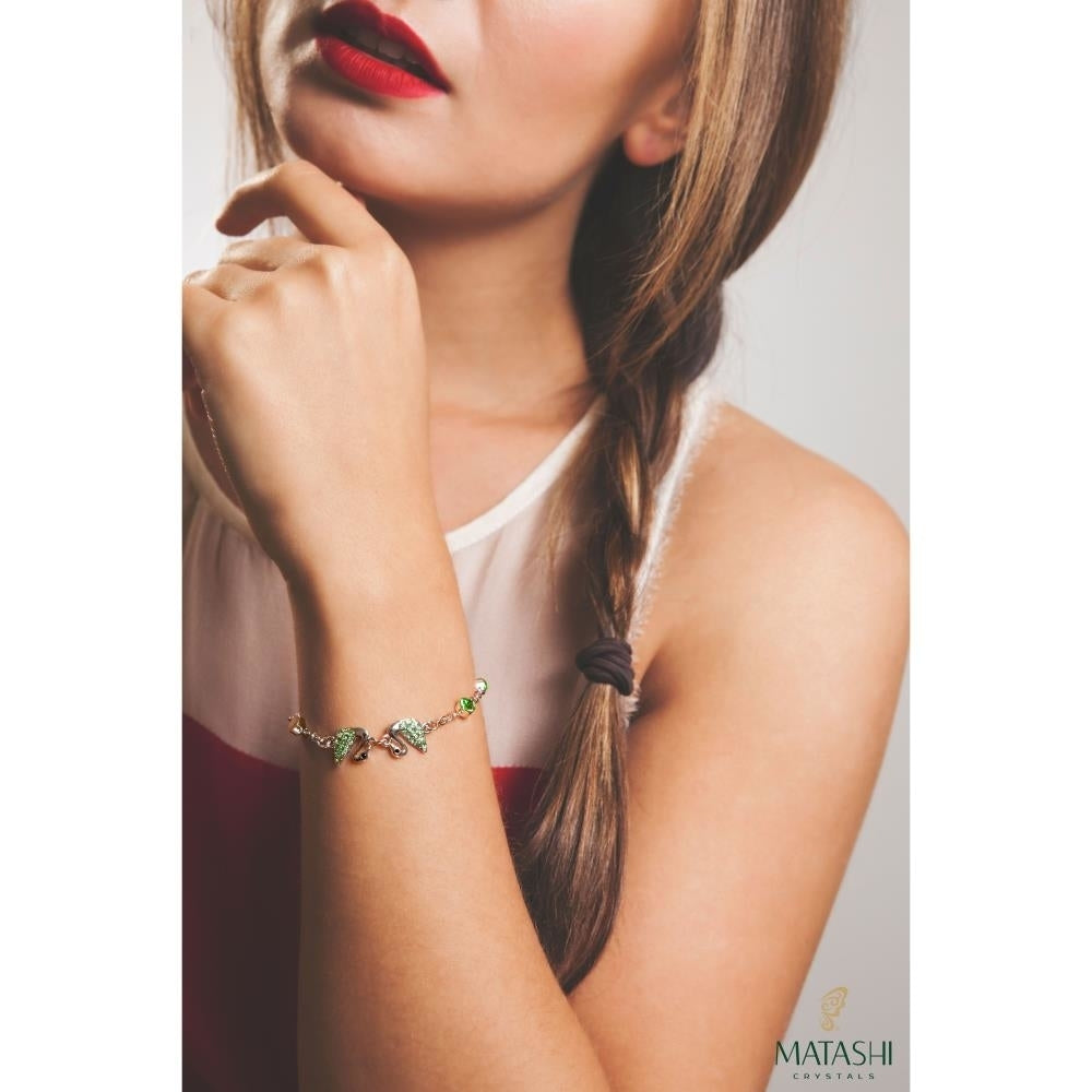 Rhodium Plated Bracelet with Loving Swans Design with Lobster Clasp and fine Olive Green Crystals by Matashi Image 4
