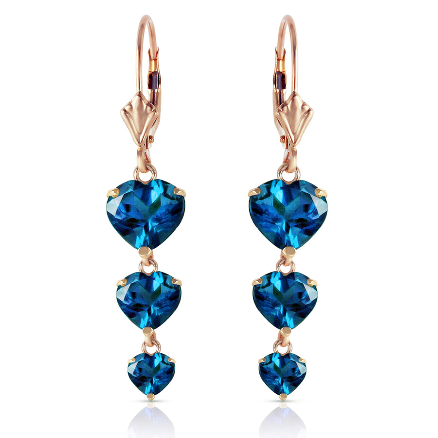 14k Solid Gold dangling Blue Topaz hearts Earrings Image 1