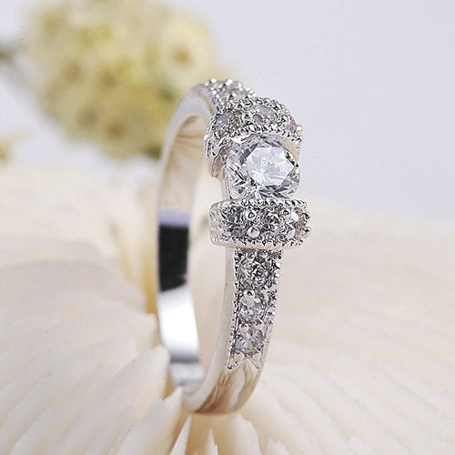 Silver Toned Ring With Round Cut Stones On Pave Setting Engagement/Promise Ring Image 2