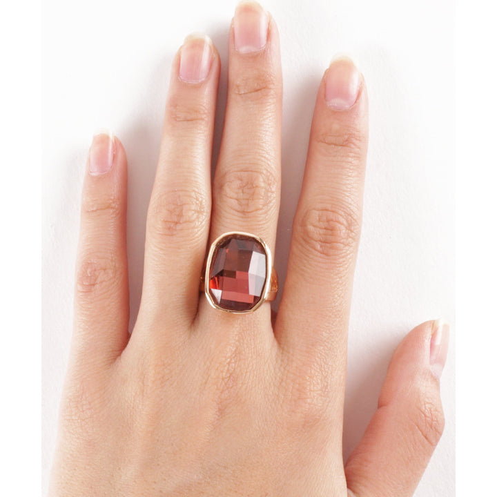 Deep Siam Red Blood Orange Colored Gemstone Set in a Rose Gold Plated Ring Image 1