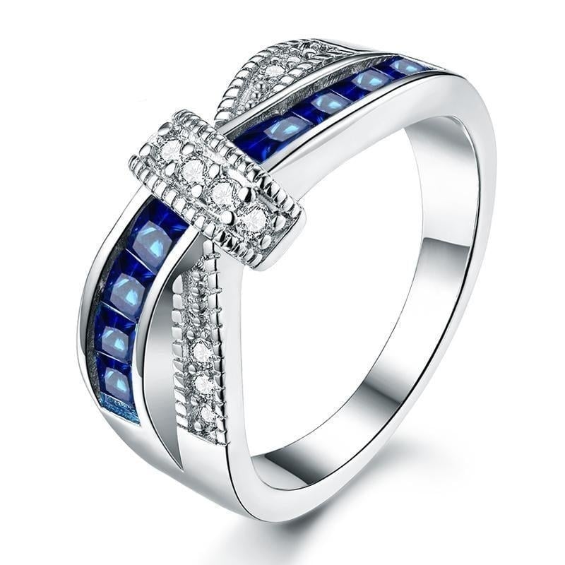 White Gold Plated Cross Blue Engagement Ring Image 1