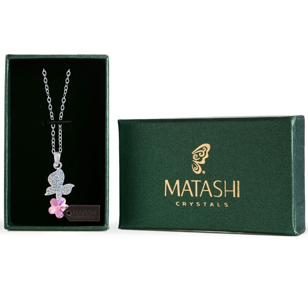 Rhodium Plated Necklace with Butterfly Alighting on a Flower Design with a 16" Extendable Chain and fine Pink Crystals Image 1