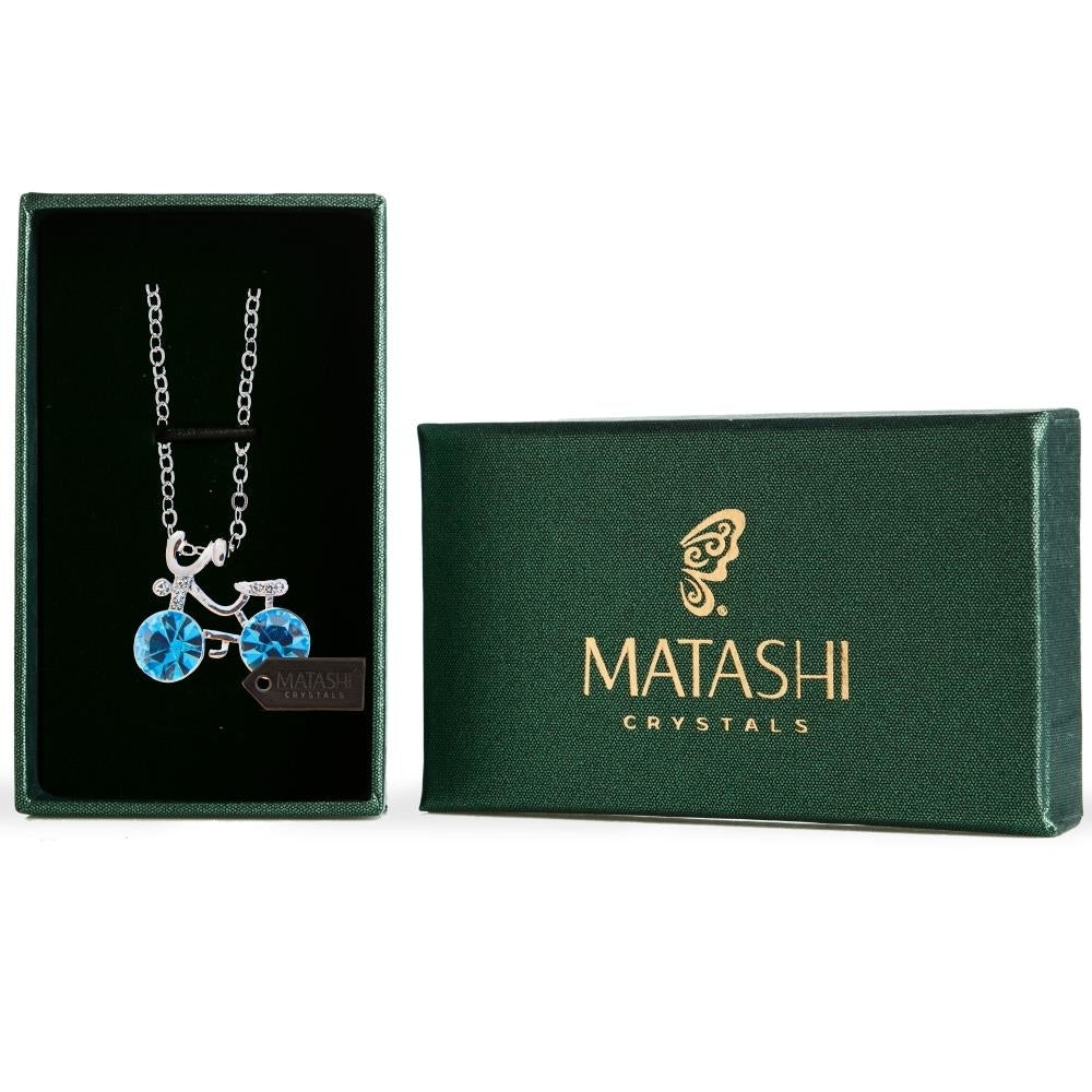 Rhodium Plated Necklace with Bicycle Design with a 16" Extendable Chain and fine Ocean Blue Crystals by Matashi Image 1