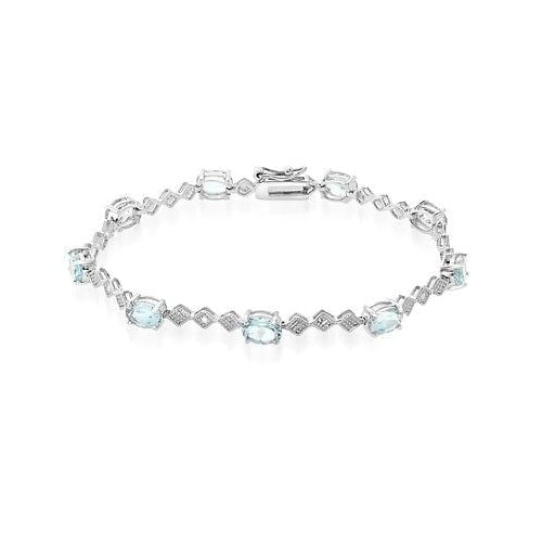 9 CARAT OVAL BLUE TOPAZ AND DIAMOND BRACELET IN RHODIUM PLATED BRASS Image 1