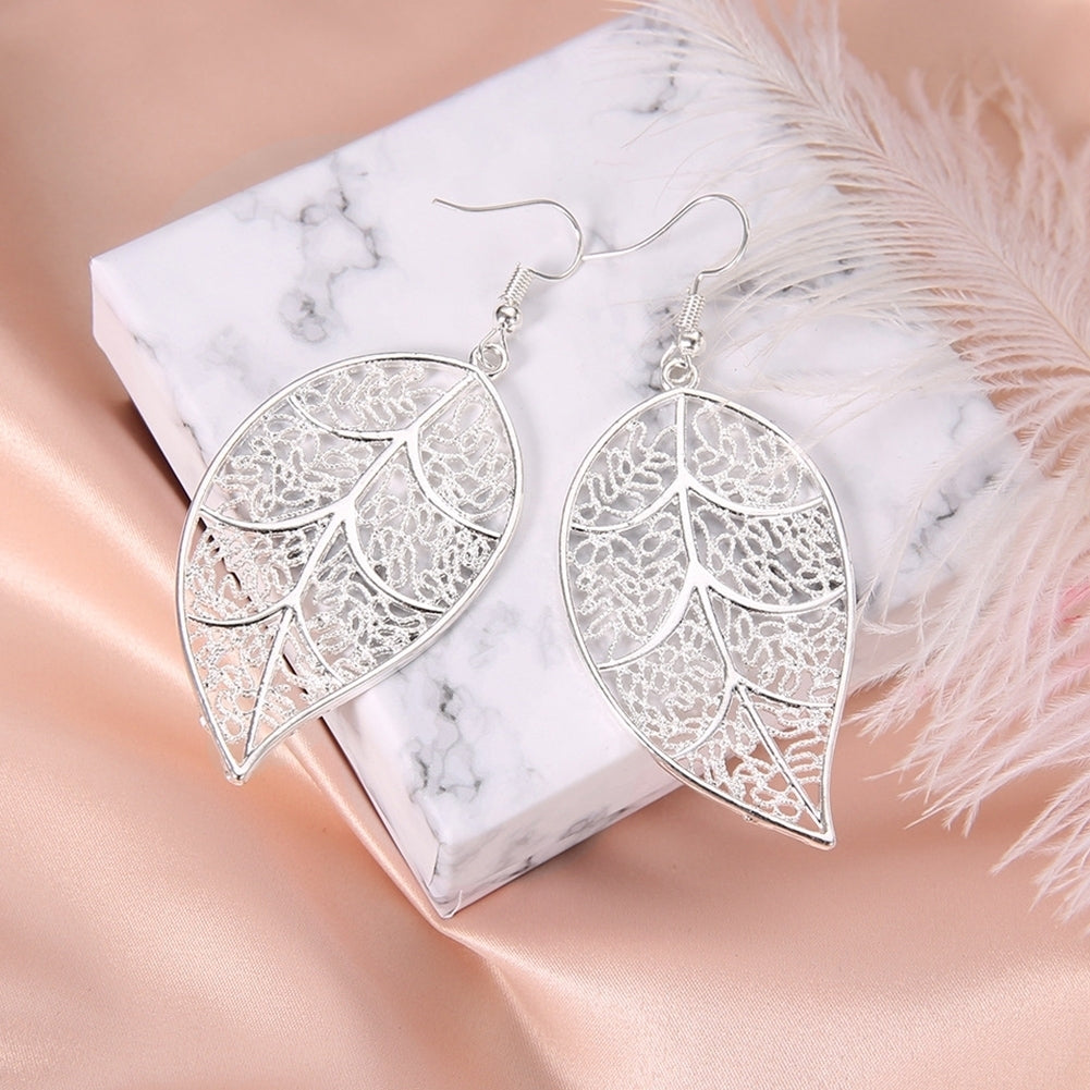 Fashion Women Hollow Carved Tree Leaf Pendant Dangle Drop Hook Earrings Jewelry Image 1