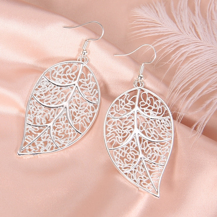 Fashion Women Hollow Carved Tree Leaf Pendant Dangle Drop Hook Earrings Jewelry Image 4