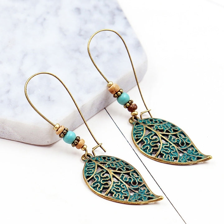 Retro Hollow Leaf Pendant Faux Turquoise Beaded Earrings Women Statement Jewelry Image 2