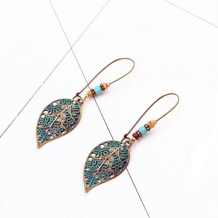 Retro Hollow Leaf Pendant Faux Turquoise Beaded Earrings Women Statement Jewelry Image 4