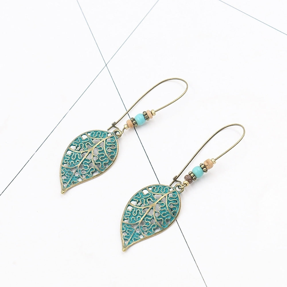 Retro Hollow Leaf Pendant Faux Turquoise Beaded Earrings Women Statement Jewelry Image 4