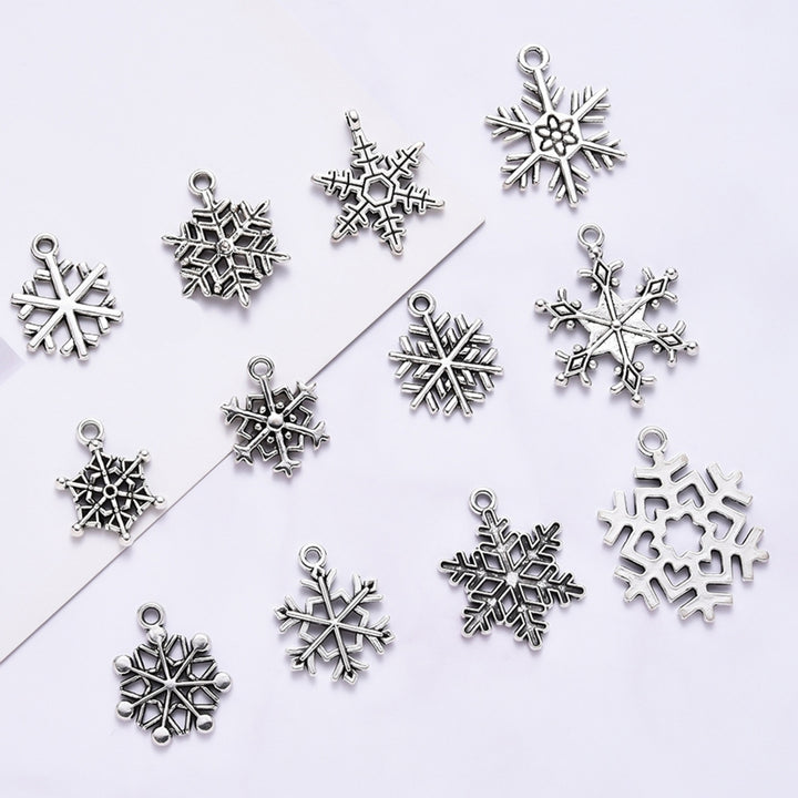 70Pcs Christmas Snowflake Charms 14 Styles Mixed DIY Antique Silver Pendants For Jewelry Making Image 1