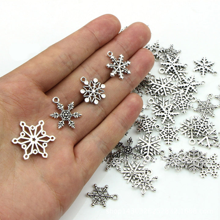 70Pcs Christmas Snowflake Charms 14 Styles Mixed DIY Antique Silver Pendants For Jewelry Making Image 4