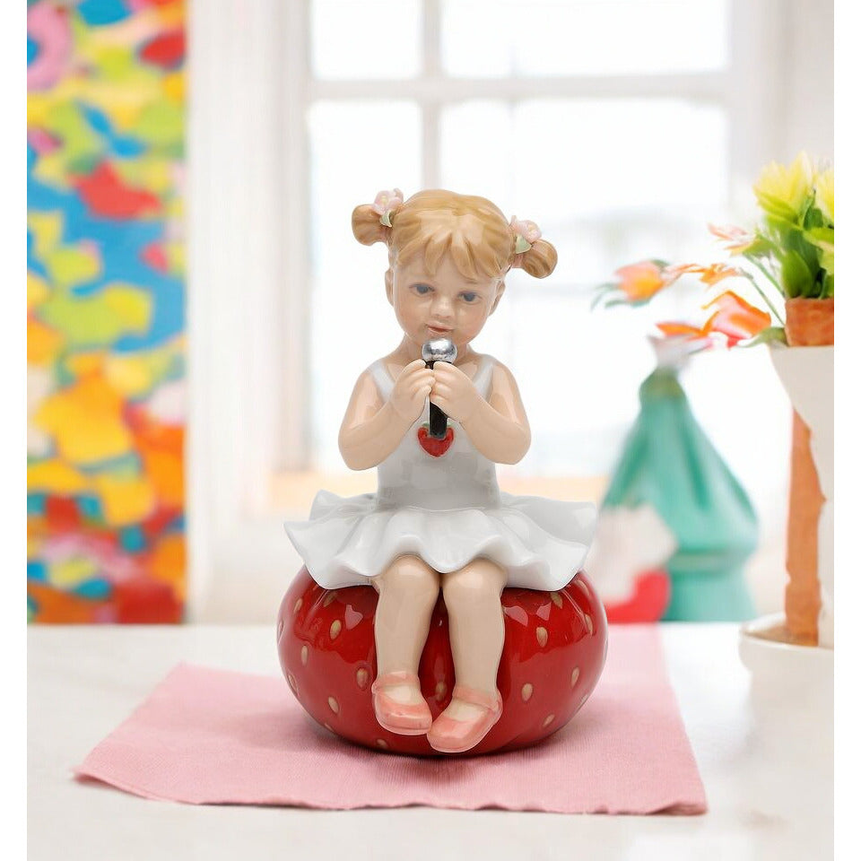 Ceramic Girl Playing on Bean Bag Figurine 4.25 Inches Image 1