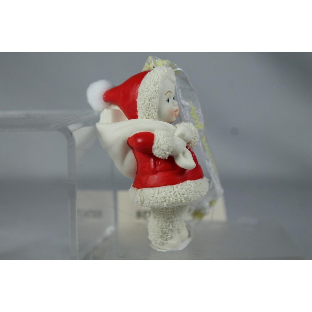 Snowbabies Dept 56 Santas Sidekick 2024 With Gift Bag Ornament 6014157 Image 1