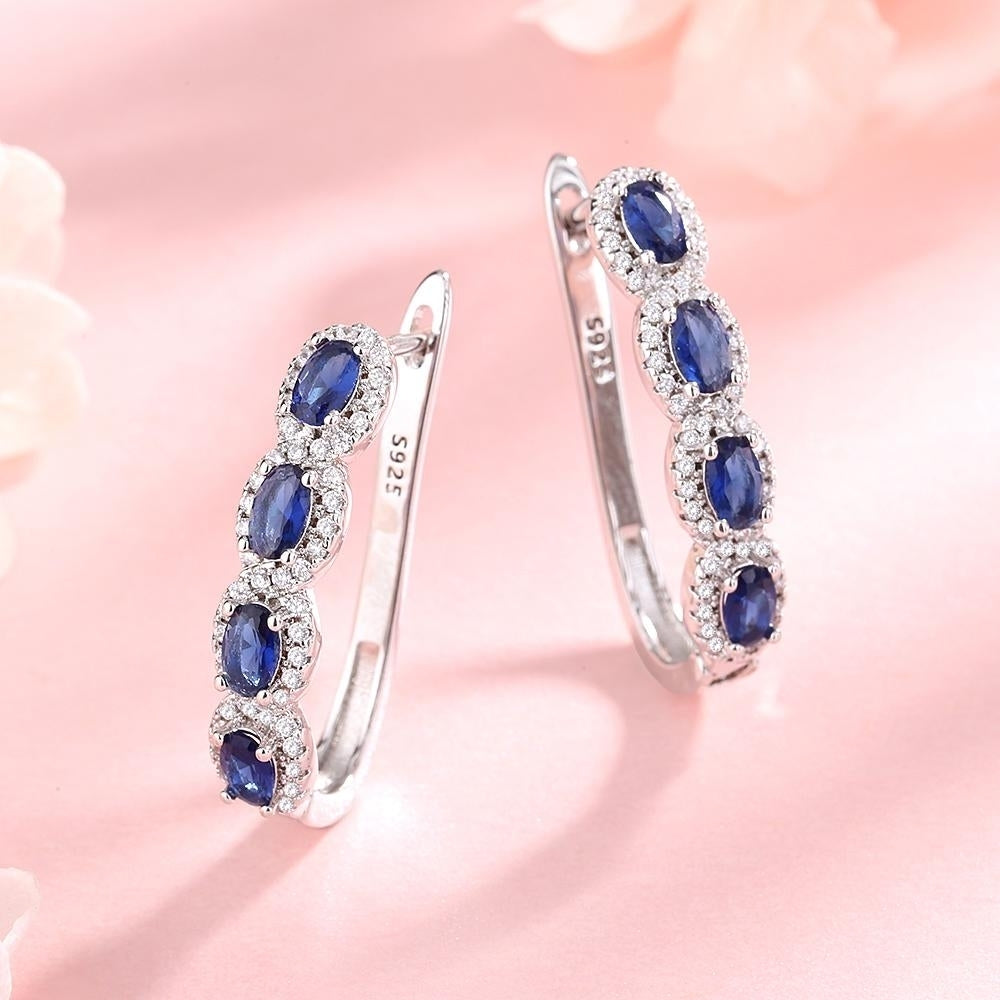 Sapphire Halo Huggie Earrings in Sterling Silver Image 1