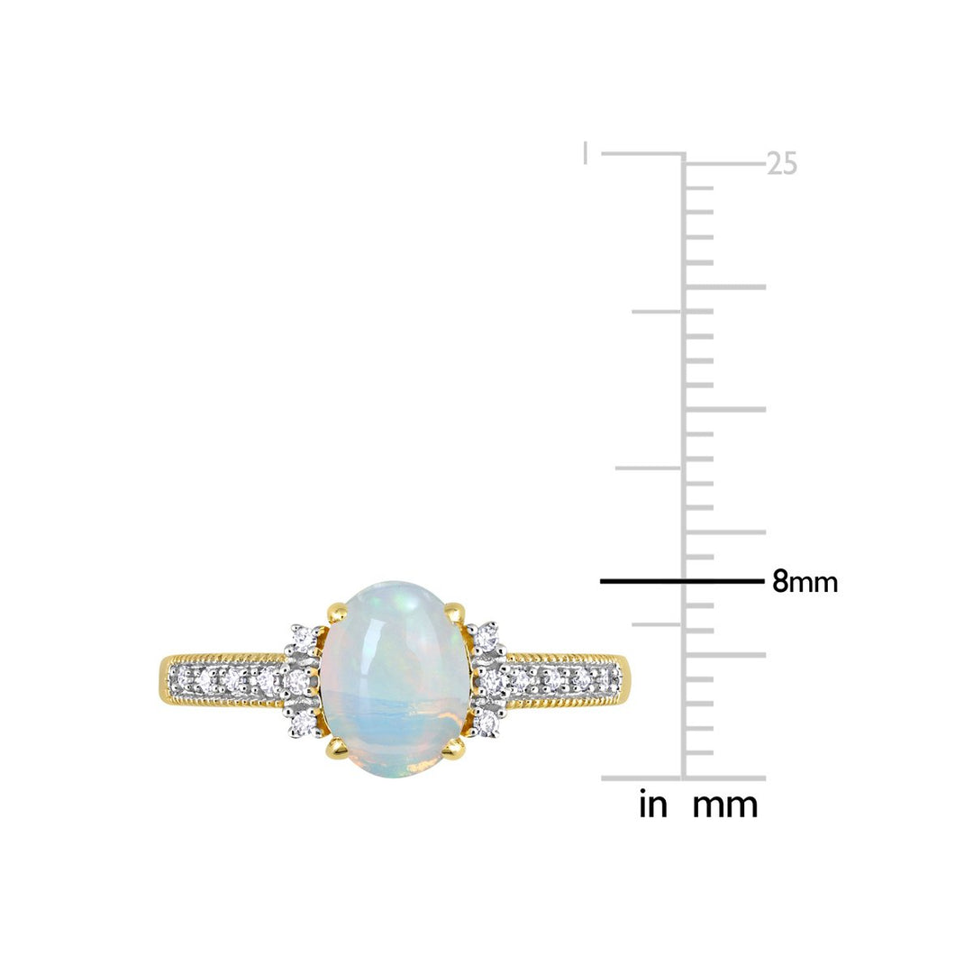 3/4 Carat (ctw) Oval Blue Opal Ring in 10K Yellow Gold Image 3