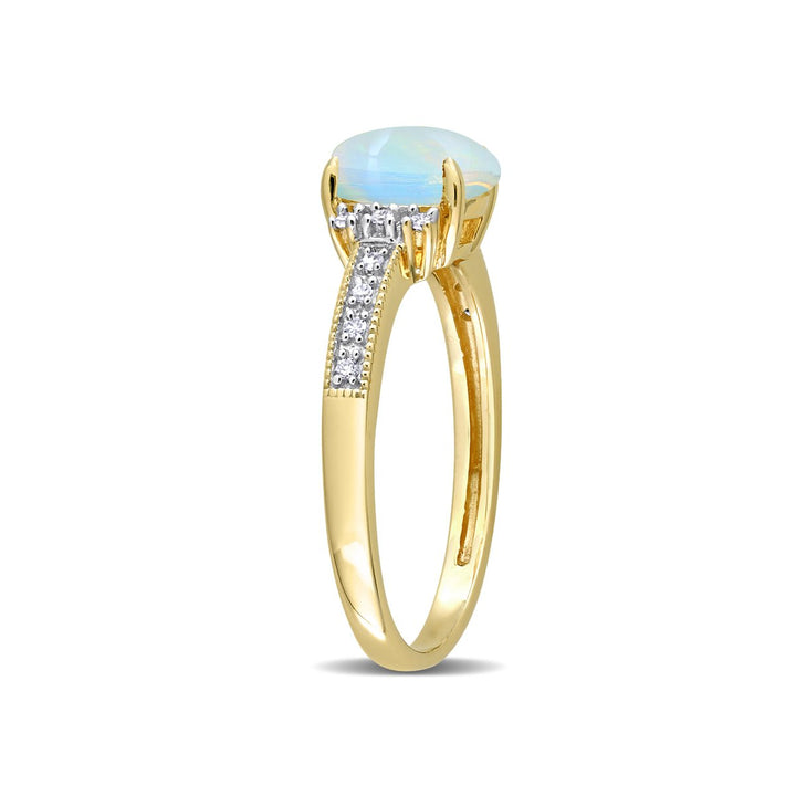 3/4 Carat (ctw) Oval Blue Opal Ring in 10K Yellow Gold Image 4